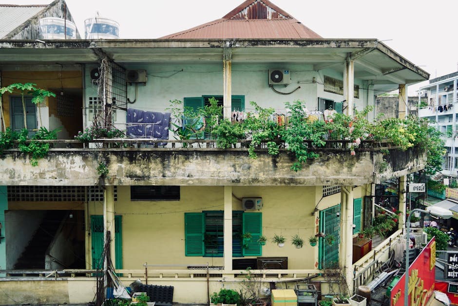 Lush balcony garden with plants in containers in urban setting