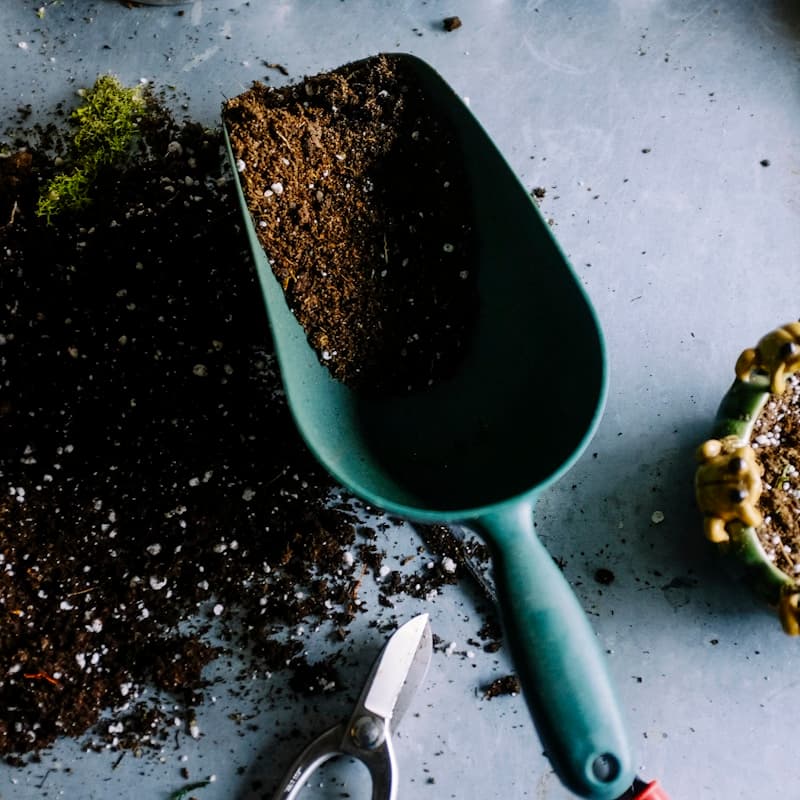 Three-bin composting system with finished compost
